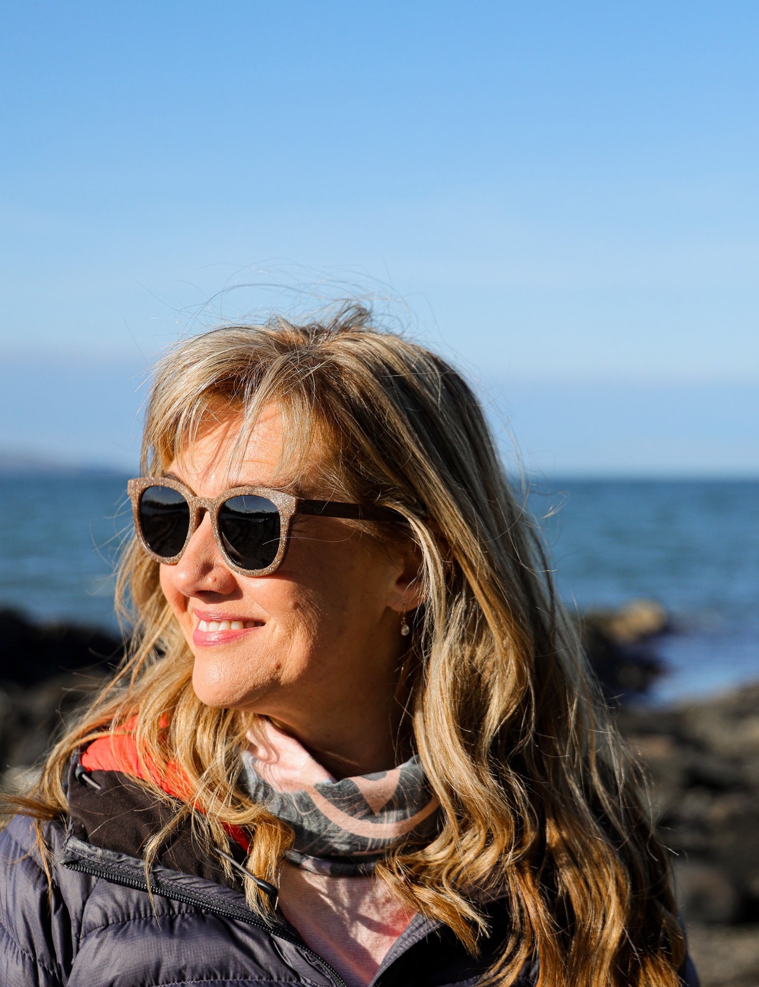 Made with sustainable speckled charcoal wheat straw or coffee residue frame and walnut wood temples, these stylish shades are lightweight, comfortable and eco-friendly with their plastic alternative materials. Fitted with UV400 polarised lenses in a smoke black colour and subtle logo is engraved on the temples. Sunglasses come with a padded pouch and microfibre cleaning cloth. 