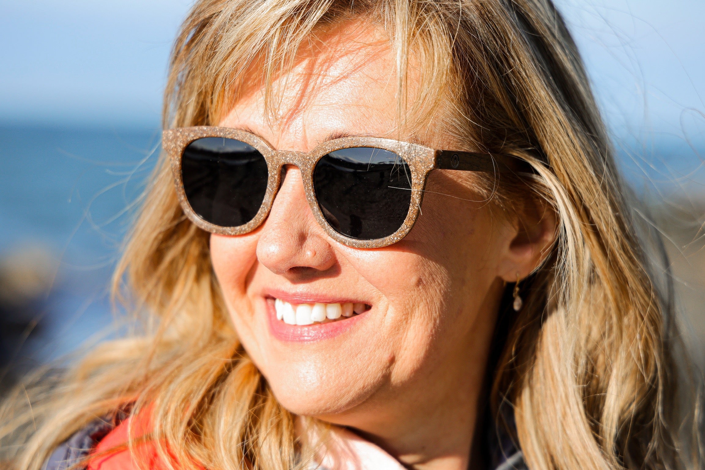 Made with sustainable speckled charcoal wheat straw or coffee residue frame and walnut wood temples, these stylish shades are lightweight, comfortable and eco-friendly with their plastic alternative materials. Fitted with UV400 polarised lenses in a smoke black colour and subtle logo is engraved on the temples. Sunglasses come with a padded pouch and microfibre cleaning cloth. 